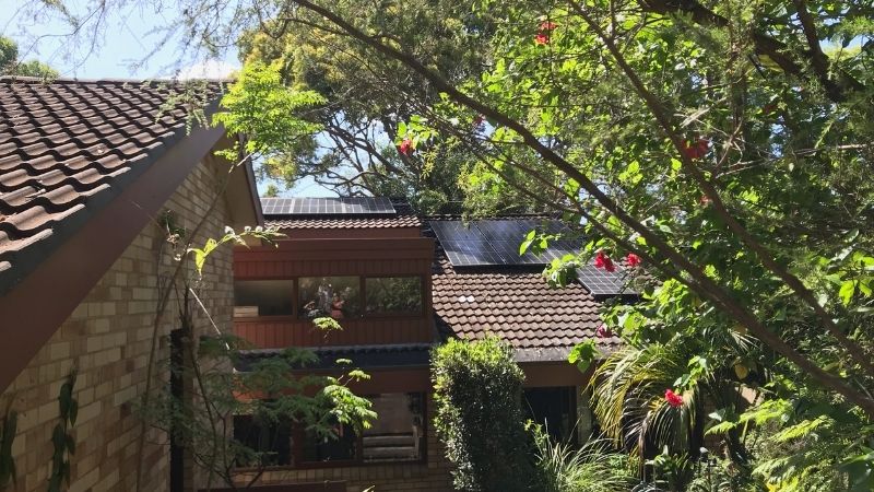 shaded roof with solar panels